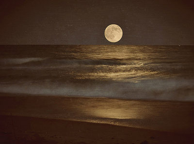 Full moon rising from the ocean. Click for credits